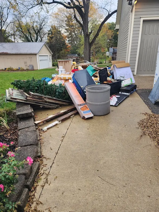 Dumpster being loaded with debris for Commercial Dumpster Rental in Dodge City